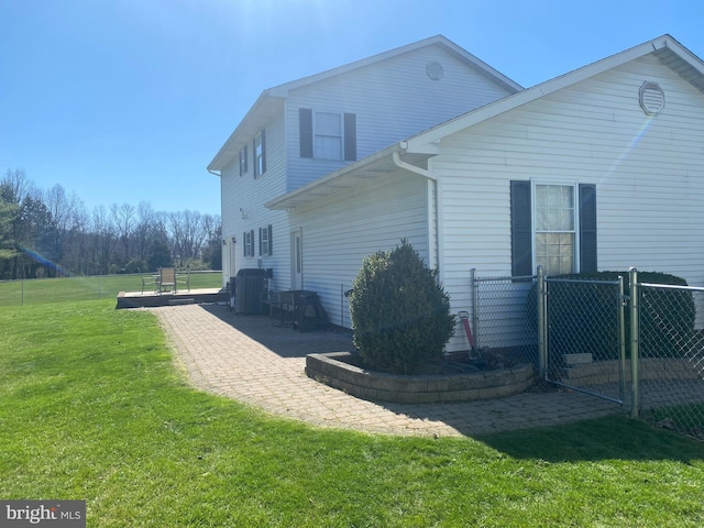 view of home's exterior featuring a yard