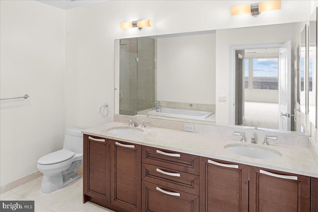 bathroom featuring toilet, double sink, tile flooring, a bathing tub, and large vanity