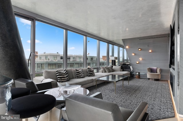 living room featuring floor to ceiling windows