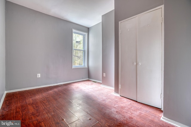 unfurnished bedroom with light wood-type flooring