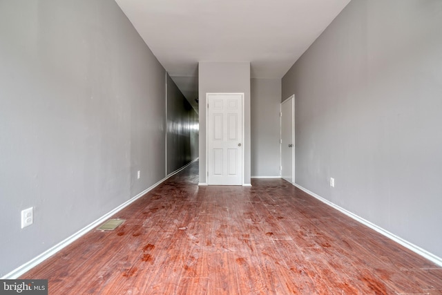 spare room with dark hardwood / wood-style floors