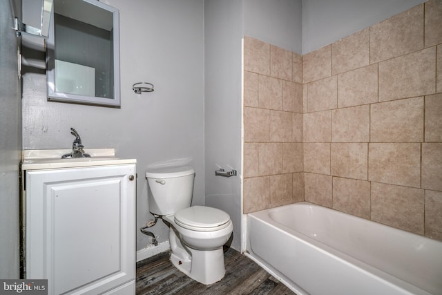 full bathroom featuring toilet, wood-type flooring, bathing tub / shower combination, and vanity