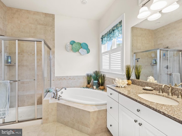 bathroom with tile flooring, separate shower and tub, and vanity