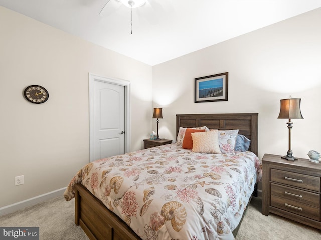 bedroom featuring light carpet and ceiling fan