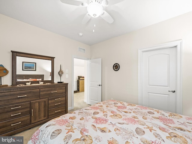 bedroom with ceiling fan and light colored carpet