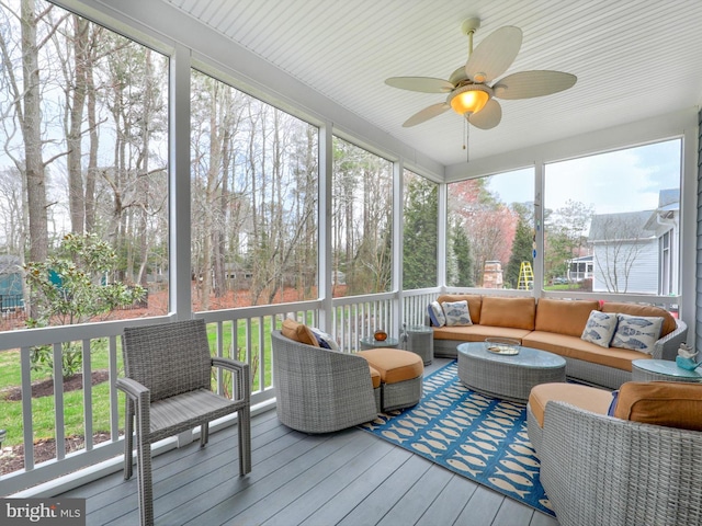 sunroom / solarium with plenty of natural light and ceiling fan