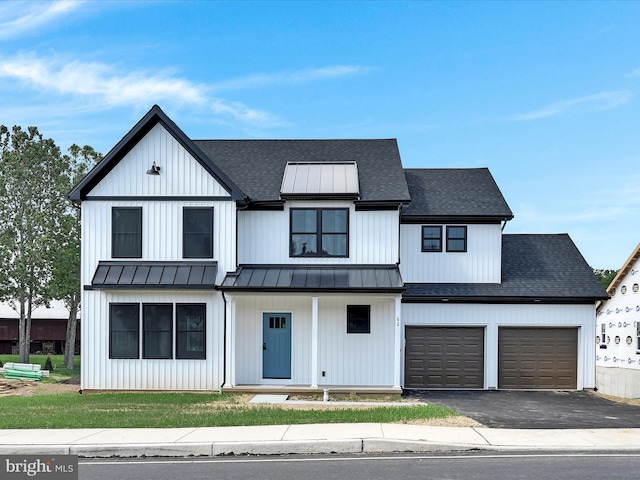 modern farmhouse style home featuring a garage