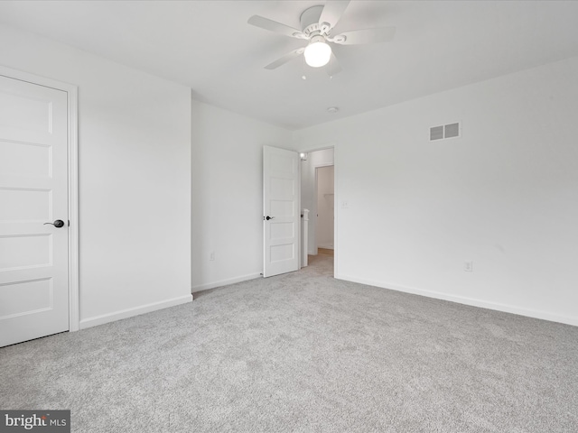 carpeted empty room with ceiling fan