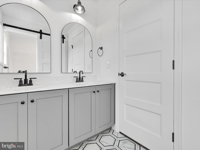 bathroom featuring double sink vanity and tile floors