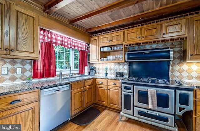 kitchen with tasteful backsplash, light stone counters, beam ceiling, dishwasher, and wooden ceiling