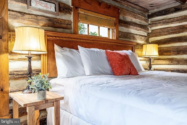 bedroom featuring rustic walls and wood ceiling