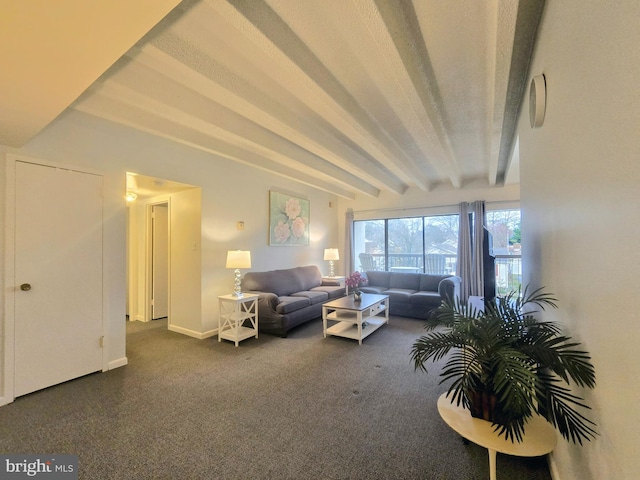 living room featuring beamed ceiling