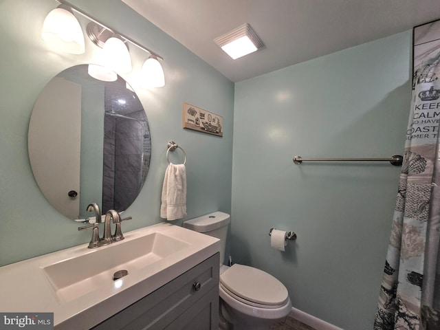 bathroom with toilet and vanity