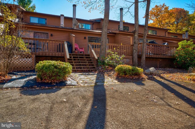 rear view of house with a wooden deck