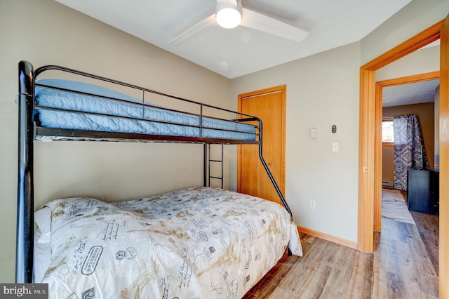 bedroom featuring ceiling fan and light wood-type flooring