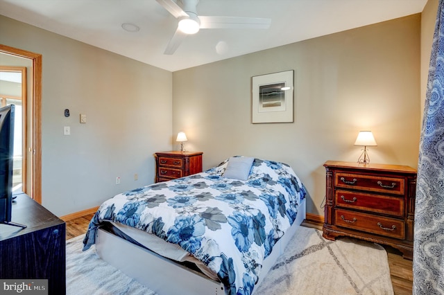 bedroom featuring light hardwood / wood-style floors and ceiling fan