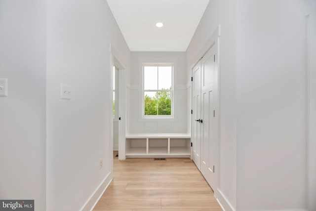 hall with light wood-type flooring