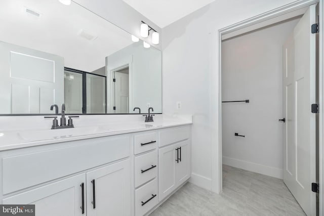 bathroom featuring tile flooring and double vanity