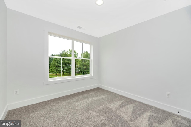 unfurnished room featuring carpet flooring