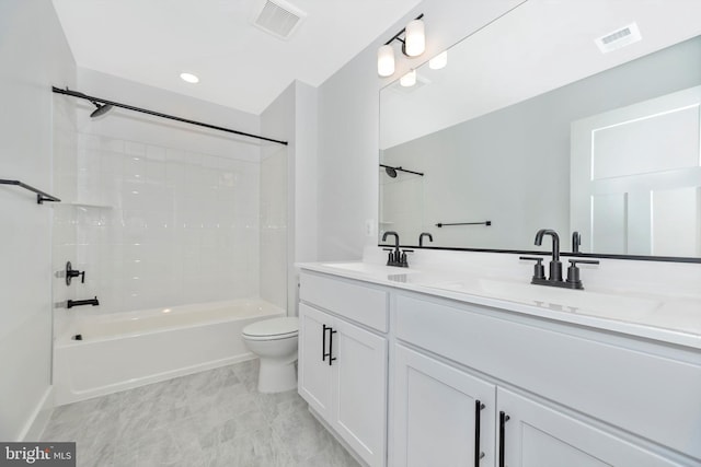 full bathroom with tiled shower / bath combo, toilet, tile floors, and double sink vanity