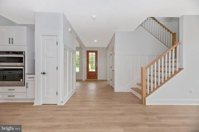 foyer entrance featuring light wood-type flooring