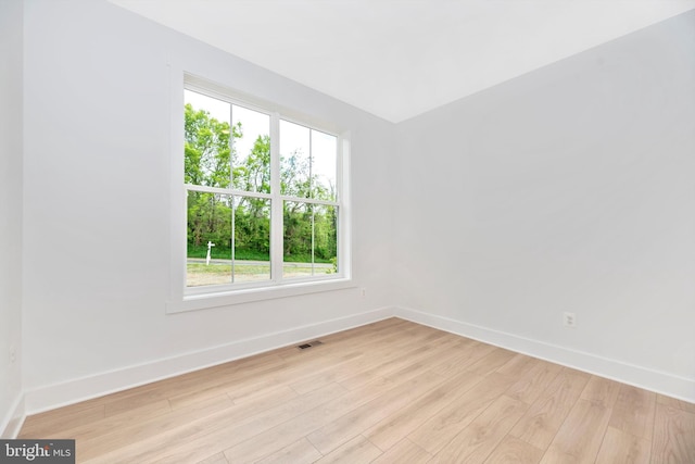 unfurnished room featuring light hardwood / wood-style flooring