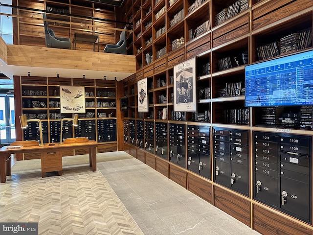 wine room featuring mail boxes and light tile floors