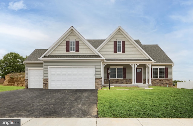 craftsman house with covered porch and a front yard