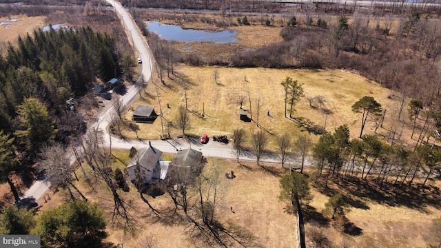 birds eye view of property with a rural view