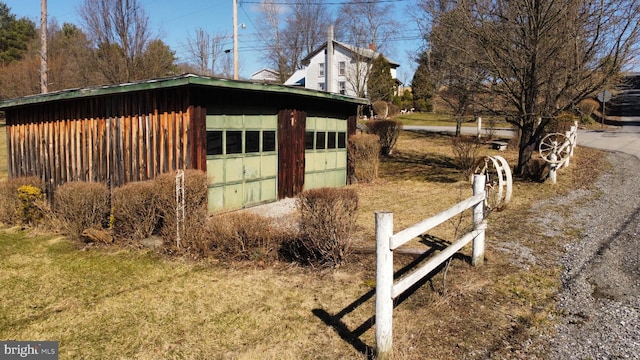 view of side of property with a garage