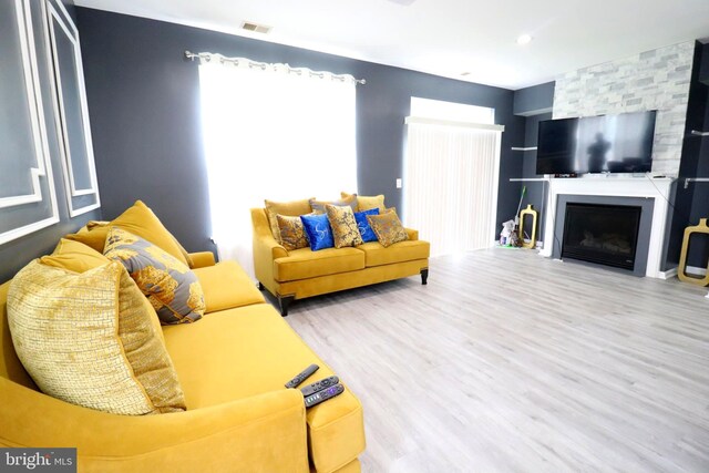 living room featuring a fireplace and hardwood / wood-style floors