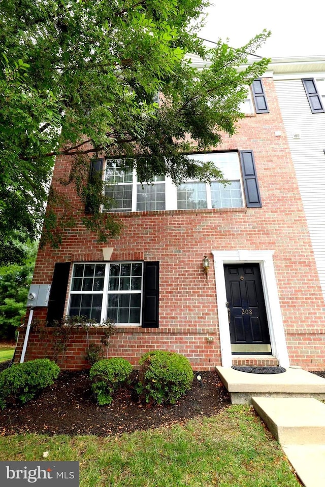 view of front of house featuring brick siding