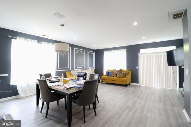 dining room with hardwood / wood-style floors