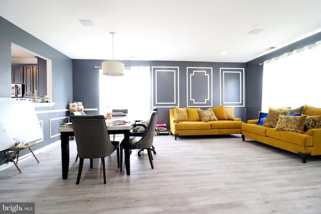 dining space with light wood-style floors