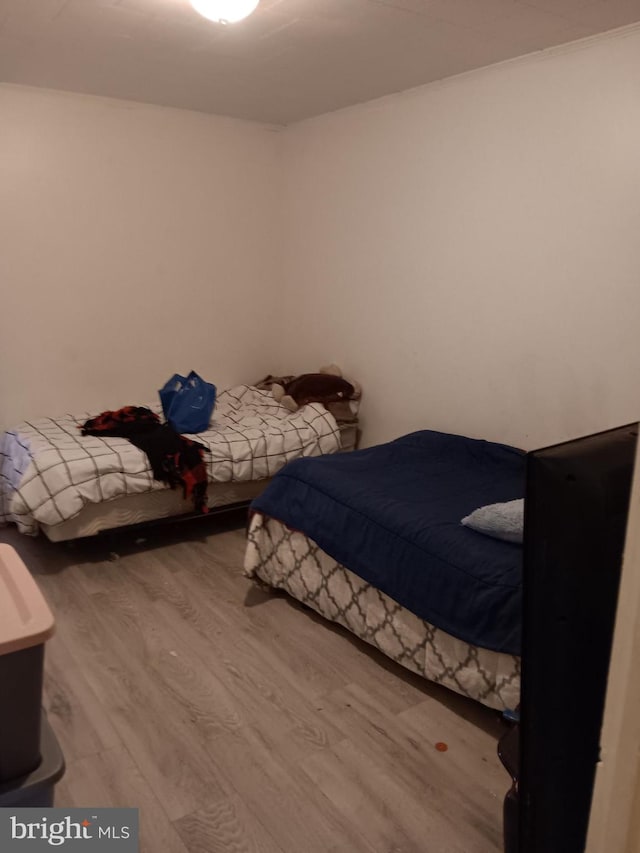 unfurnished bedroom featuring hardwood / wood-style flooring