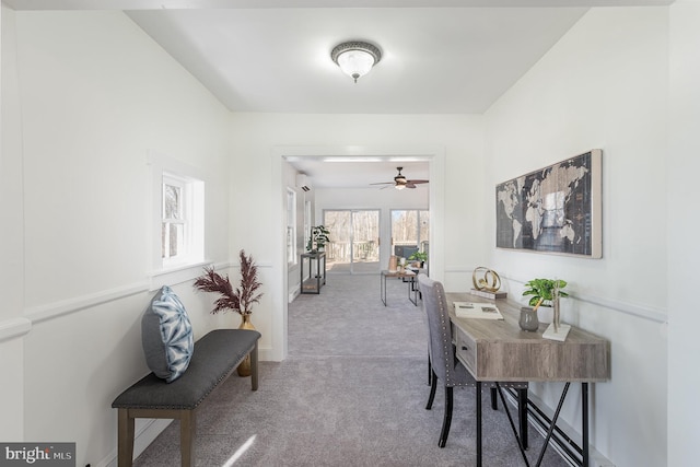 office space with ceiling fan and carpet flooring