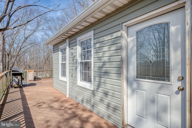 view of home's exterior featuring a wooden deck