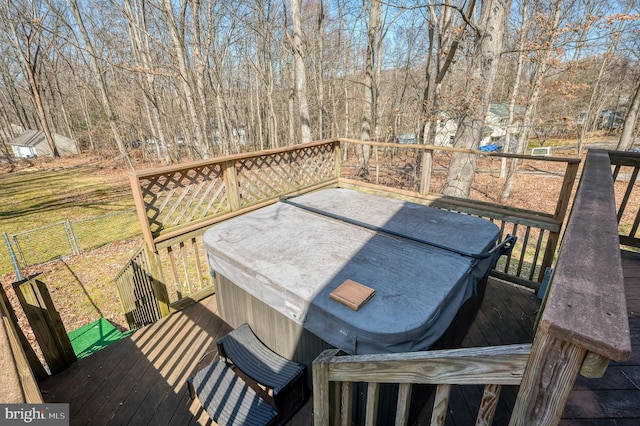 wooden terrace featuring a hot tub