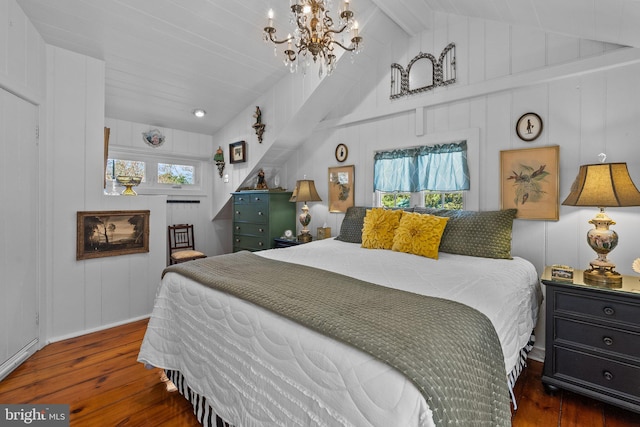 bedroom featuring lofted ceiling with beams, dark hardwood / wood-style flooring, and an inviting chandelier