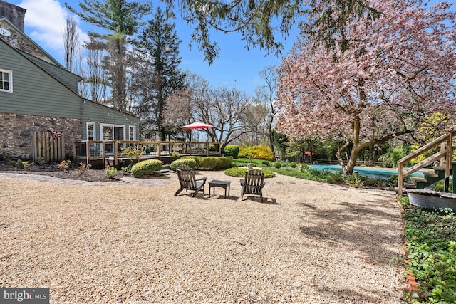 view of yard with a pool side deck