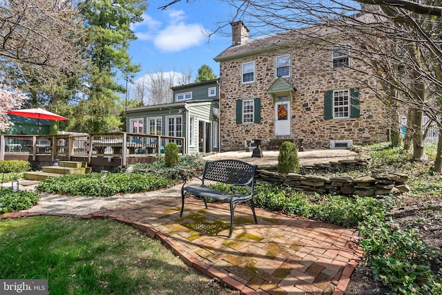 exterior space featuring a patio and a deck