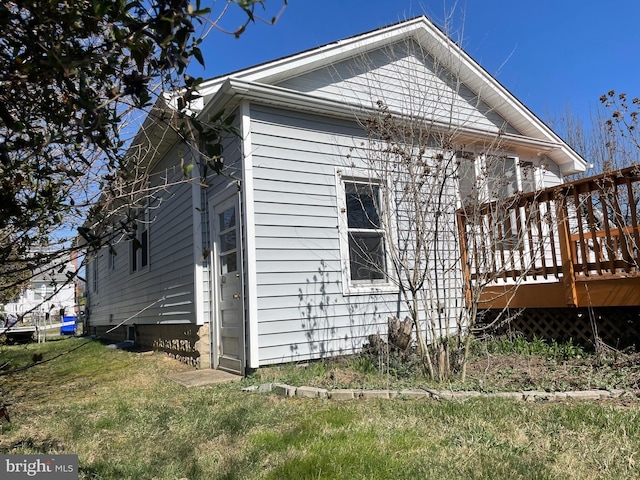 view of side of home featuring a deck