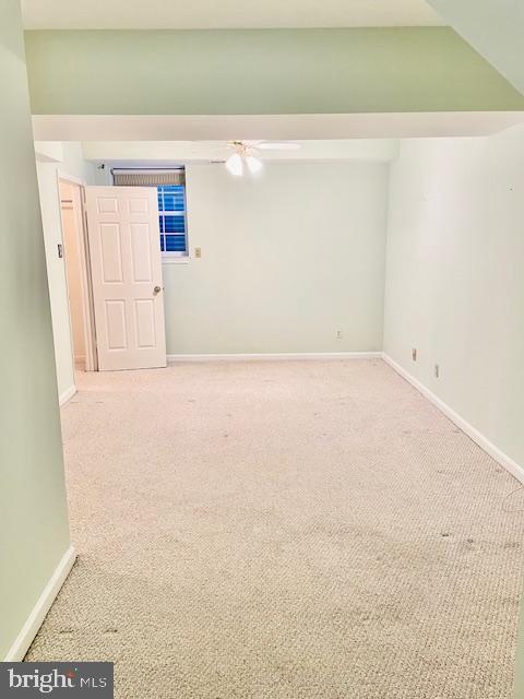 unfurnished room with light carpet