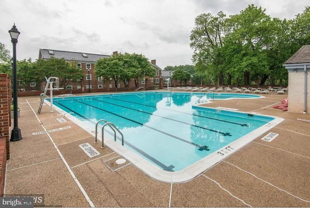 view of pool featuring a patio area