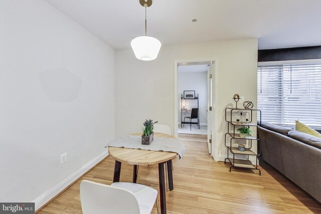 dining area featuring light wood-type flooring