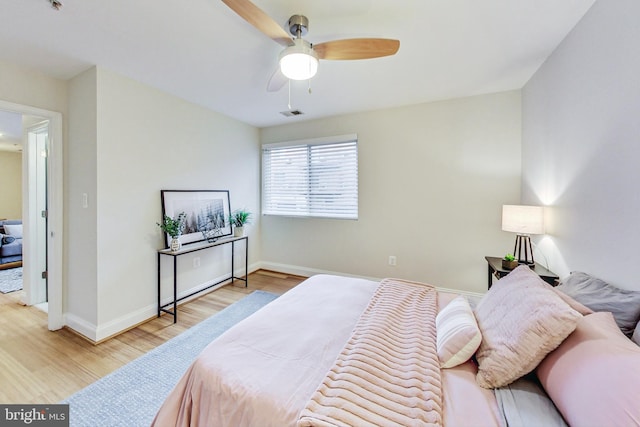 bedroom featuring light hardwood / wood-style flooring and ceiling fan