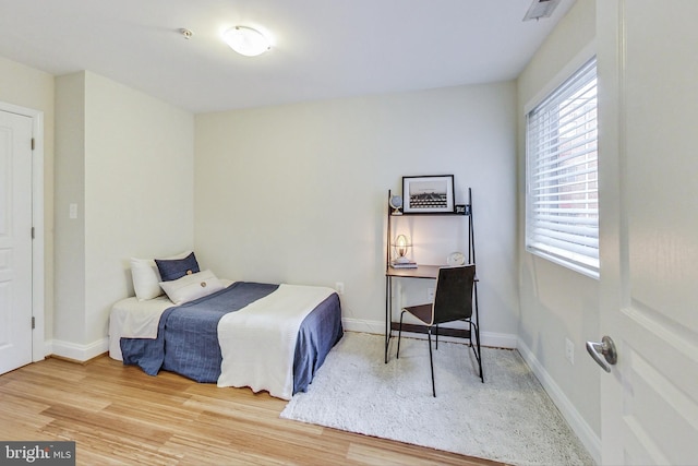 bedroom featuring wood-type flooring