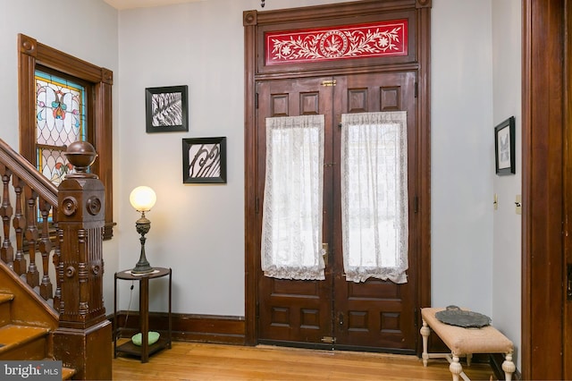 entryway featuring french doors and light hardwood / wood-style floors