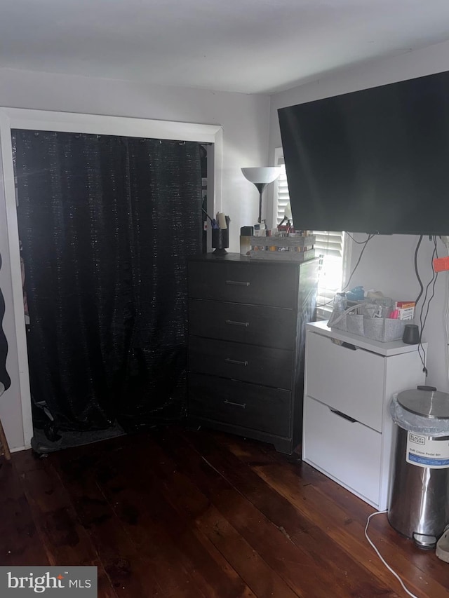 bedroom featuring dark hardwood / wood-style flooring