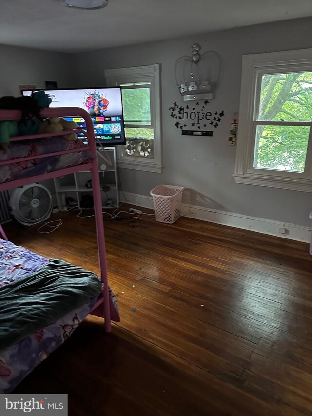 bedroom featuring dark wood-type flooring